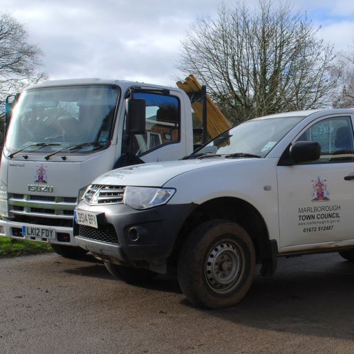 a photograph of vehicles with Marlborough Town Council branding on the side