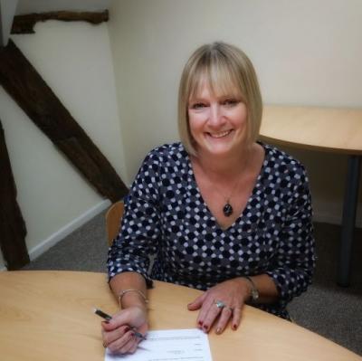 Vanessa-Hillier signing her acceptance to become a Town Councillor