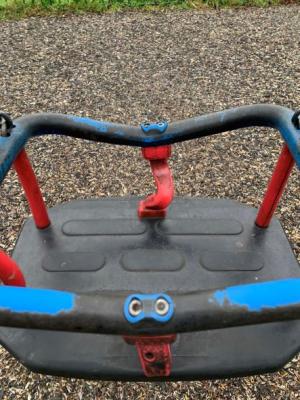 a swing seat with bent bars