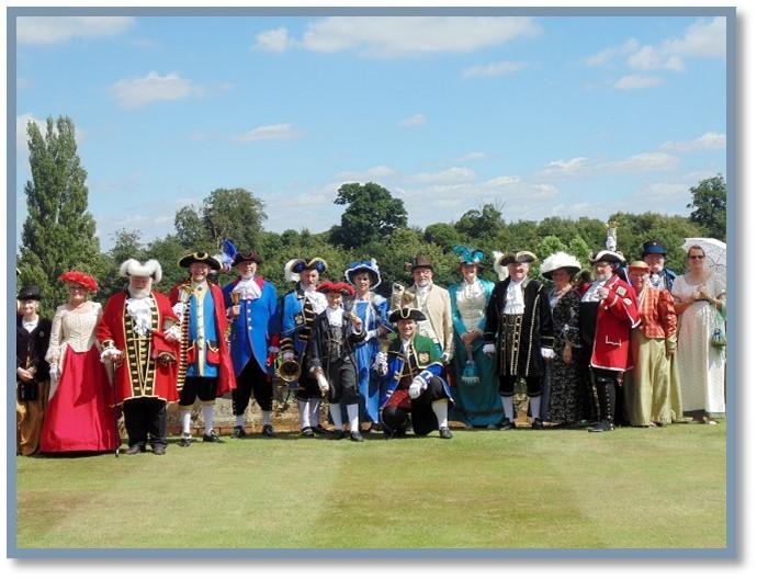 Tuppers-wins-competition-in-2016 a group of Town Criers in traditional costume pose for a photo